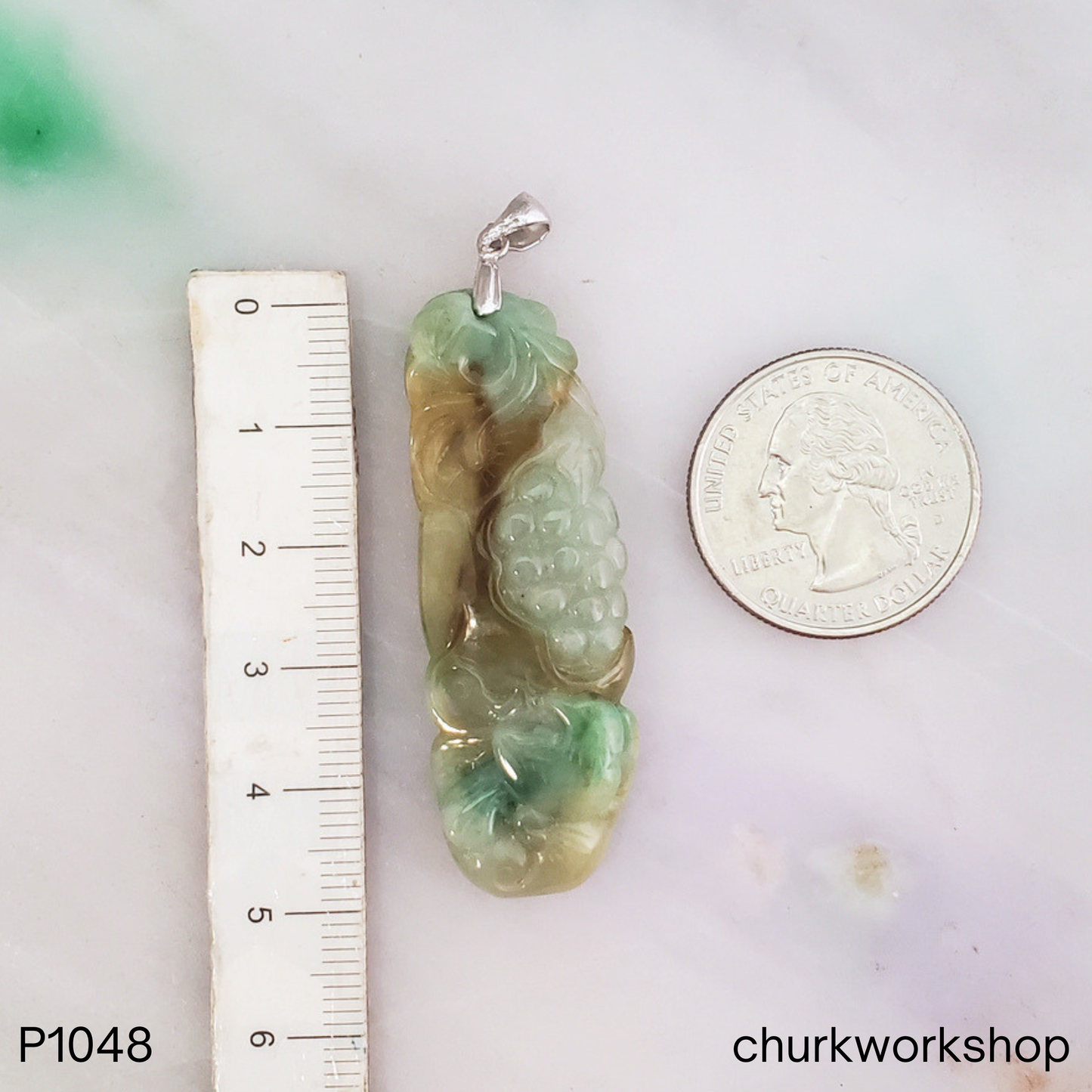 Grape vine carved brown and green jade pendant