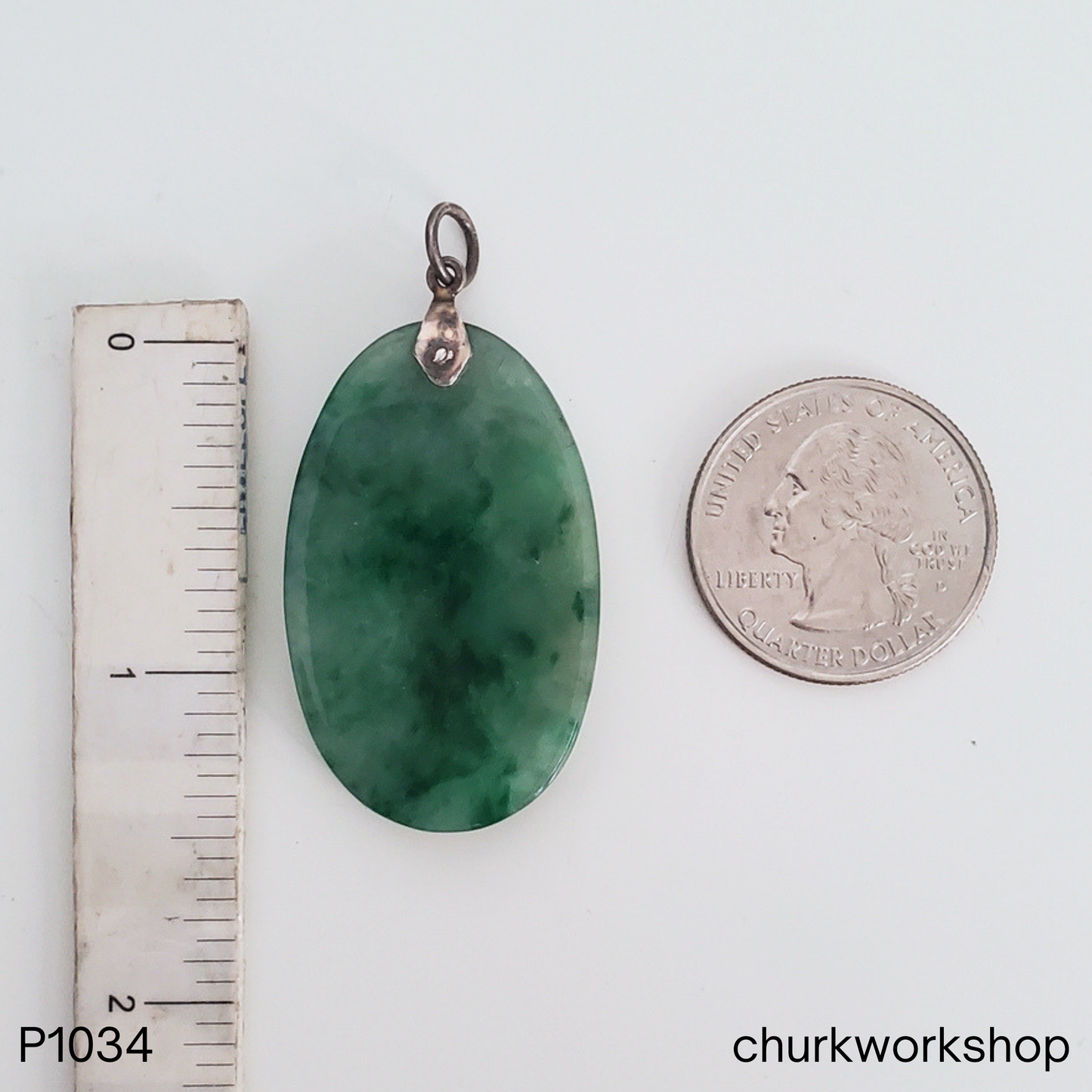Deep green oval jade pendant