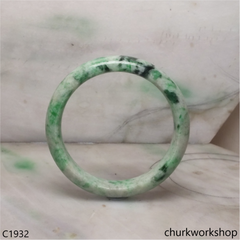 White base with green splotches  jade bangle