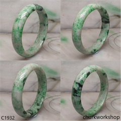 White base with green splotches  jade bangle