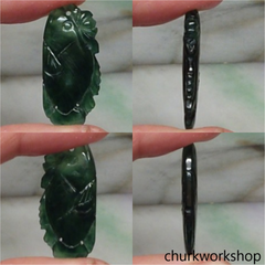 Dark green jade fish pendant