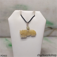 Light yellowish jade dragon pendant