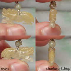 Light yellowish jade dragon pendant