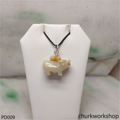 Pale yellow jade OX pendant