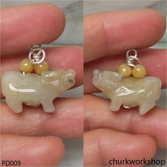 Pale yellow jade OX pendant