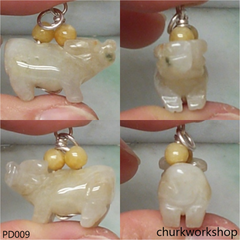Pale yellow jade OX pendant