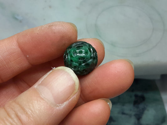 Dark green jade bead