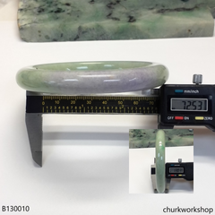 Upper arm light green with splotches lavender jade bangle