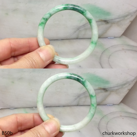 Small white base with splotches green jade bangle