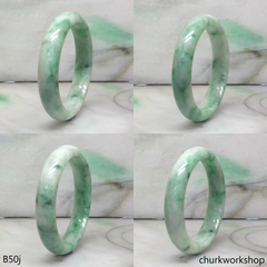 Small white base with splotches green jade bangle