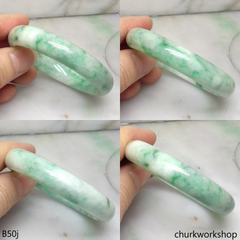 Small white base with splotches green jade bangle