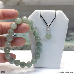 Light green beads jade bracelet with small charm