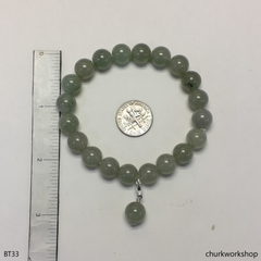 Light green beads jade bracelet with small charm