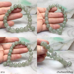 Light green beads jade bracelet with small charm