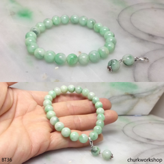 Light green beads jade bracelet with charm