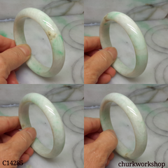 White base with splotches apple green jade bangle