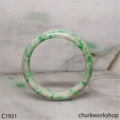 Pale yellowish base with green splotches jade bangle