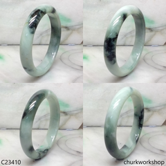 Large light green with splotches dark and bluish green jade bangle