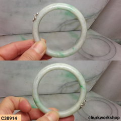 White base with splotches green jade bangle