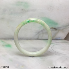 Small light green base with splotches apple green jade bangle