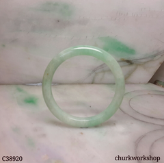 Small light green base with splotches green jade bangle