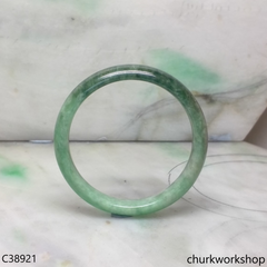 Small green base with splotches bluish green jade bangle