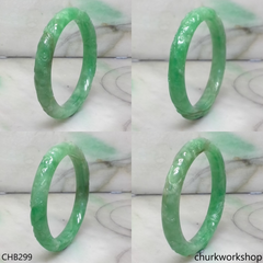 Small carved green jade bangle