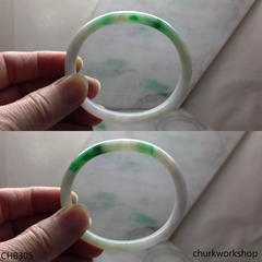 White base with splotches green & pale lavender jade bangle