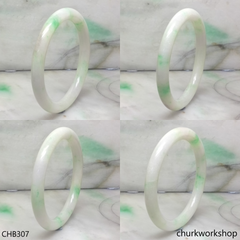 White base with splotches green jade bangle