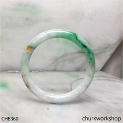 White base with splotches green & yellowish jade bangle