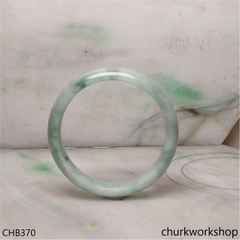 Light green with splotches bluish green jade bangle