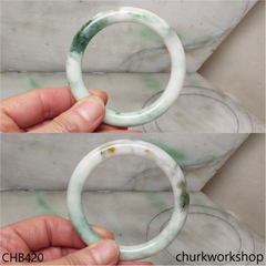 White base with splotches bluish green jade bangle