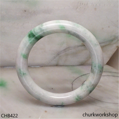 White base with splotches bluish green jade bangle