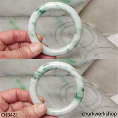 White base with splotches bluish green jade bangle