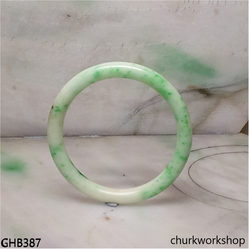 Very small white base with splotches green jade bangle