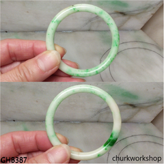 Very small white base with splotches green jade bangle