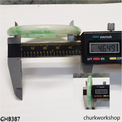 Very small white base with splotches green jade bangle