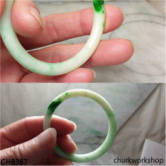 Very small white base with splotches green jade bangle