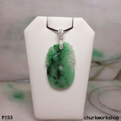 Carved jade pendant.