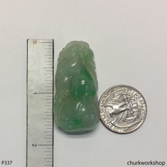 Light green carved jade pendant.