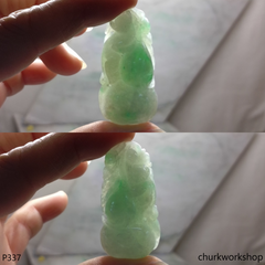 Light green carved jade pendant.