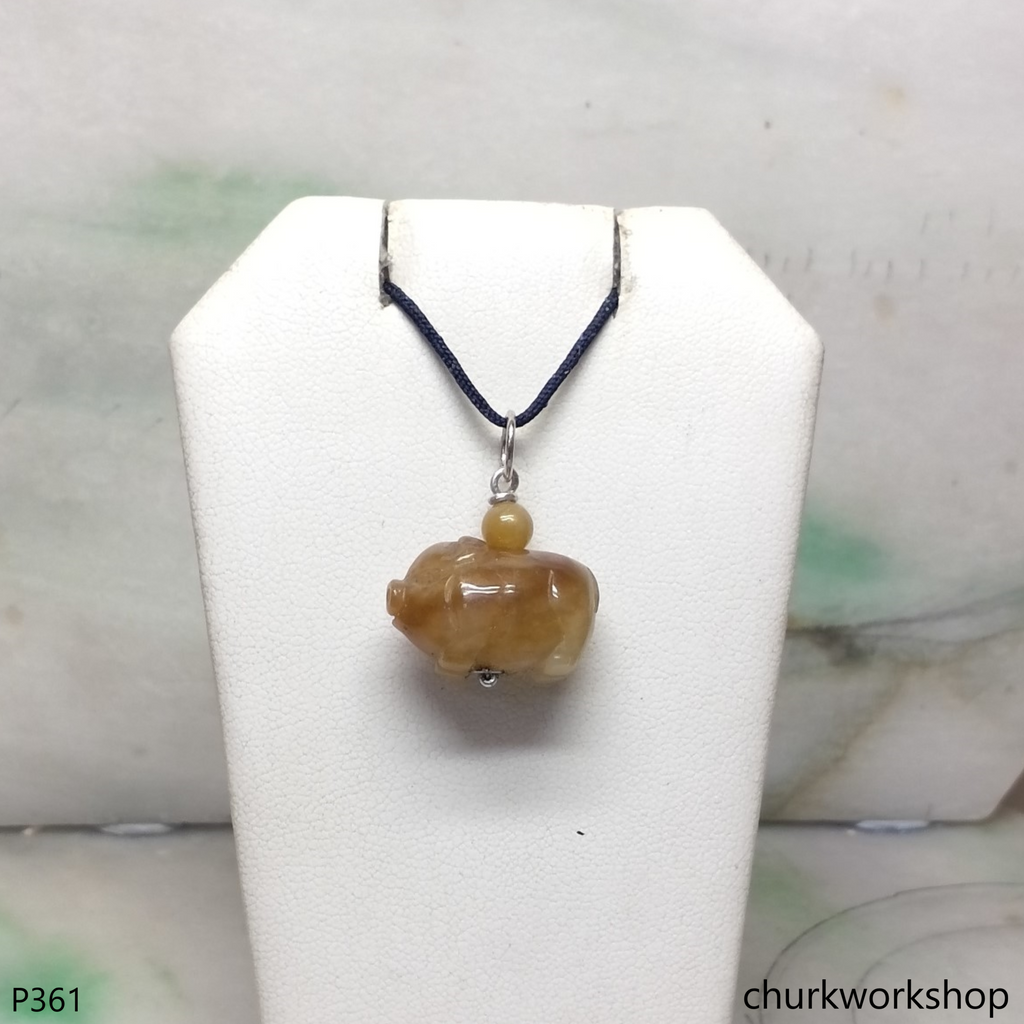 Red jade pig pendant with silver bail