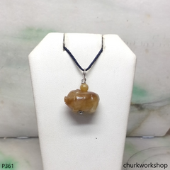 Red jade pig pendant with silver bail