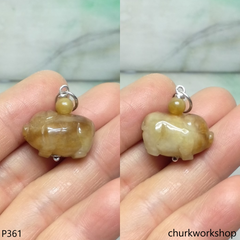 Red jade pig pendant with silver bail