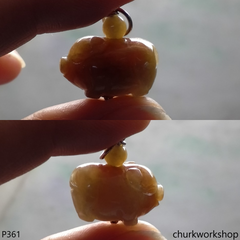 Red jade pig pendant with silver bail