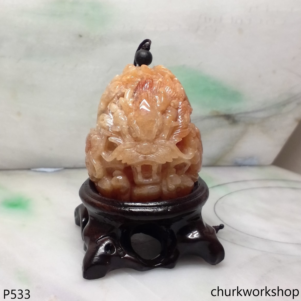 Light red jade nine dragons pendant