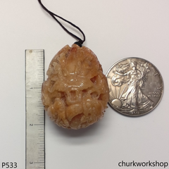 Light red jade nine dragons pendant
