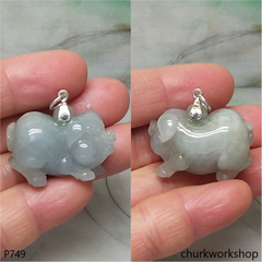 Grayish lavender jade pig with silver bail.