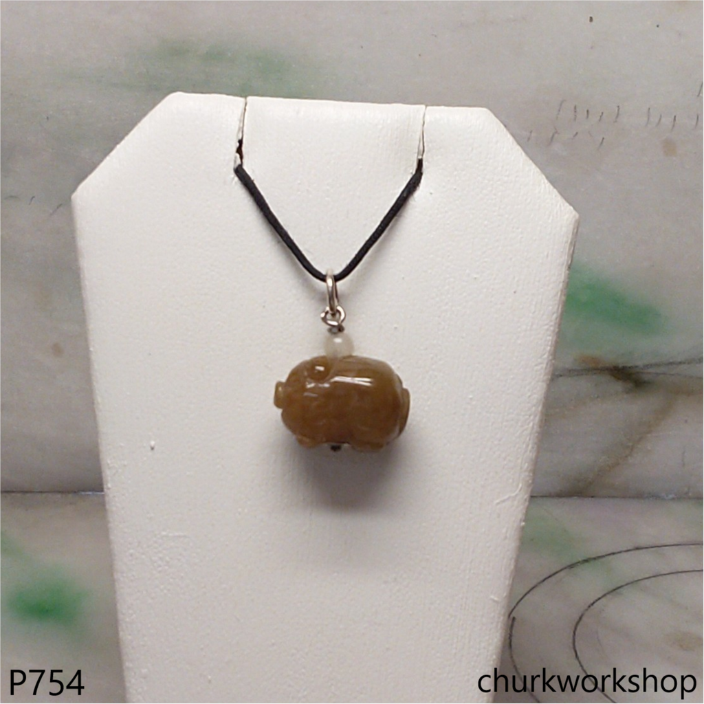 Red jade pig pendant with silver bail