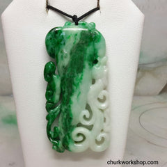 Carved jade pendant.